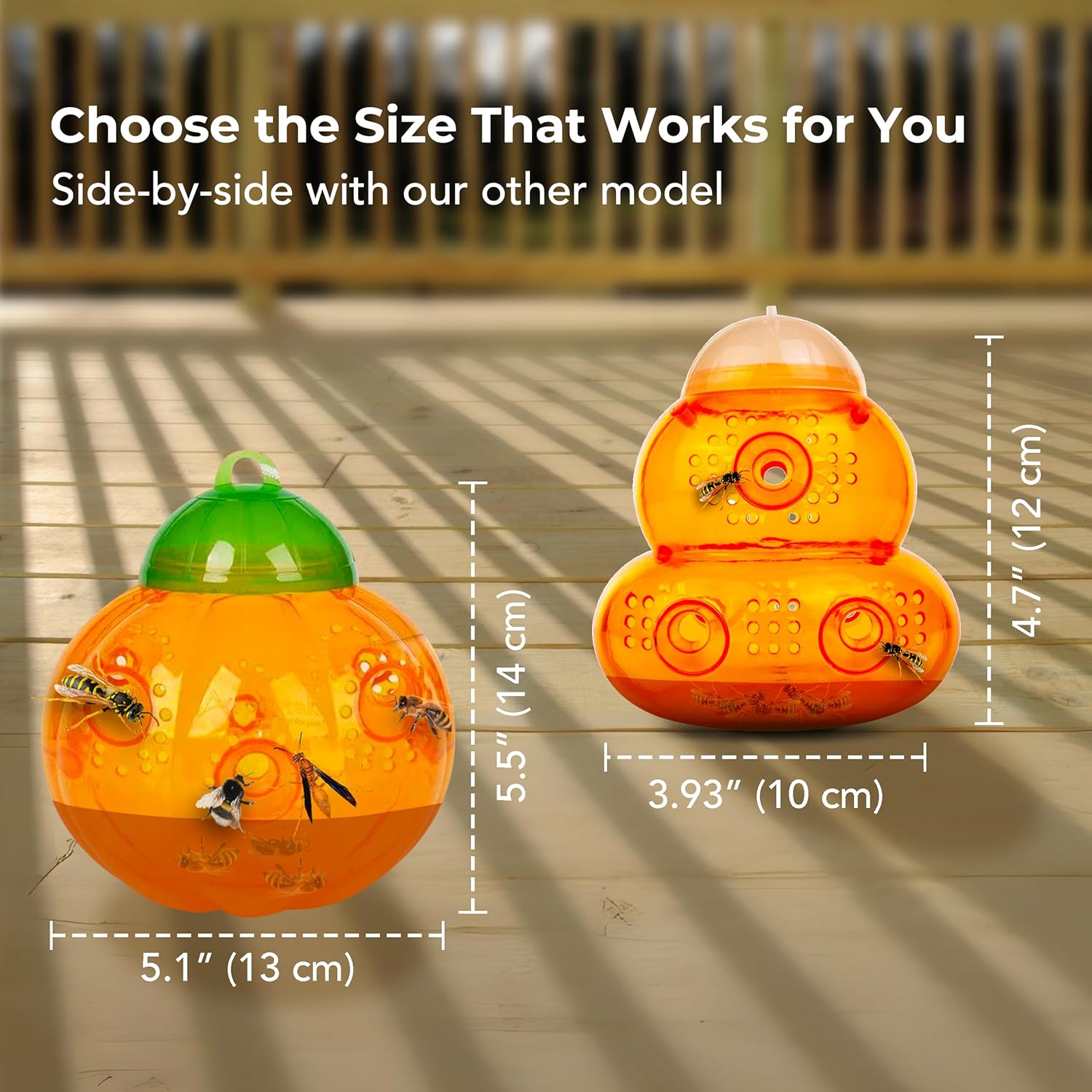 Two orange bee hotels with measurements on a wooden surface
