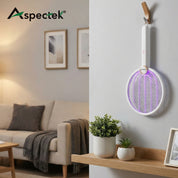 Mosquito racket with purple light on a wall next to a living room setup
